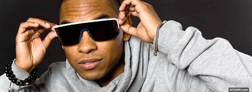 Photo miguel holding sunglasses Facebook Cover for Free