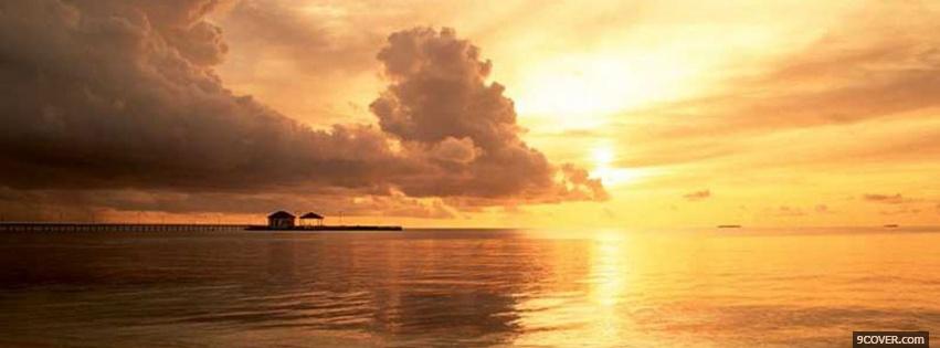 Photo sunset in the ocean Facebook Cover for Free