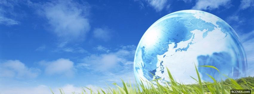 Photo earth on the grass Facebook Cover for Free
